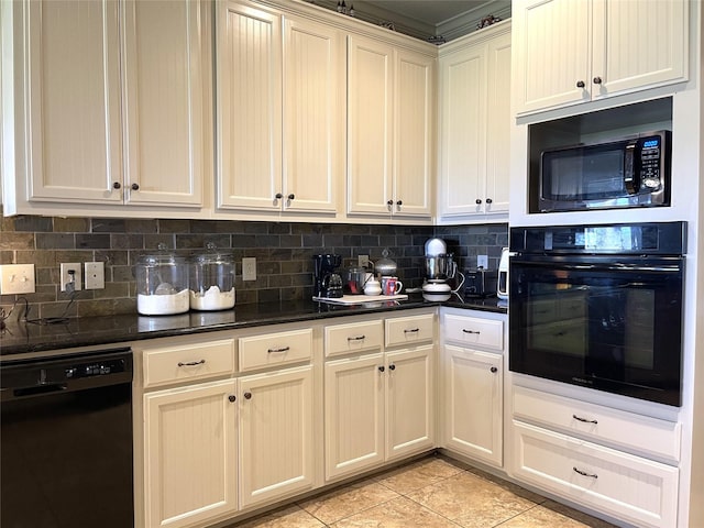 kitchen featuring tasteful backsplash, cream cabinetry, light tile patterned floors, and black appliances