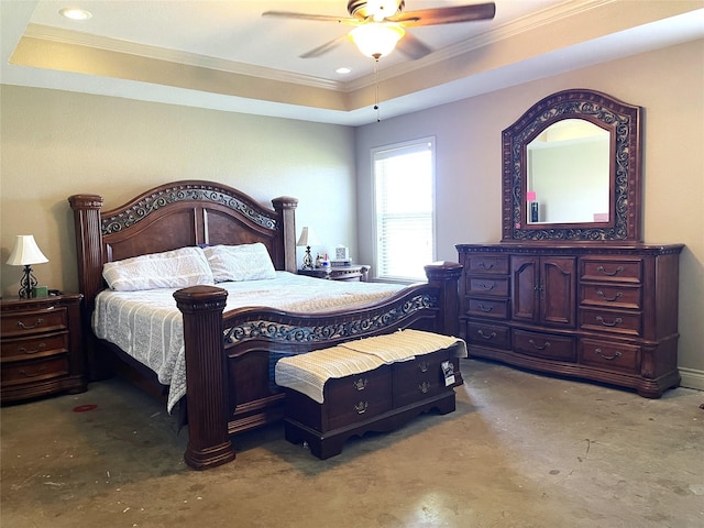 bedroom featuring a tray ceiling, ornamental molding, and ceiling fan