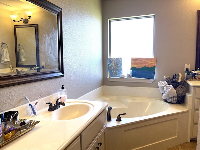 bathroom featuring vanity and a bathtub