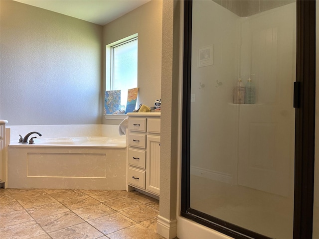 bathroom with vanity and plus walk in shower