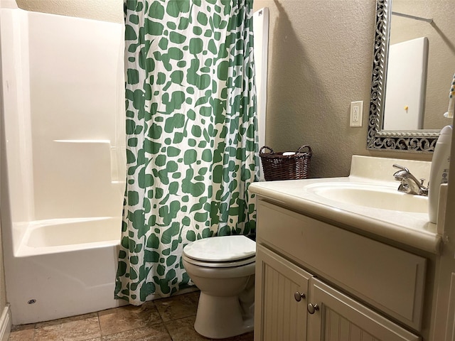 full bathroom featuring toilet, vanity, and shower / bathtub combination with curtain