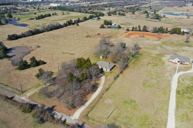 birds eye view of property featuring a rural view