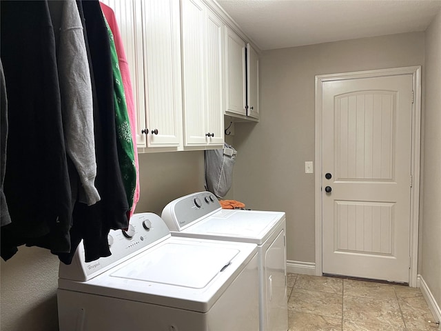 washroom with cabinets and separate washer and dryer