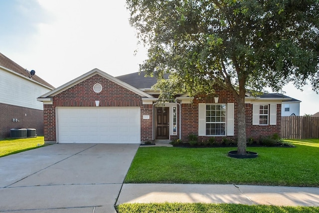 view of front of house featuring central AC unit, a garage, and a front yard