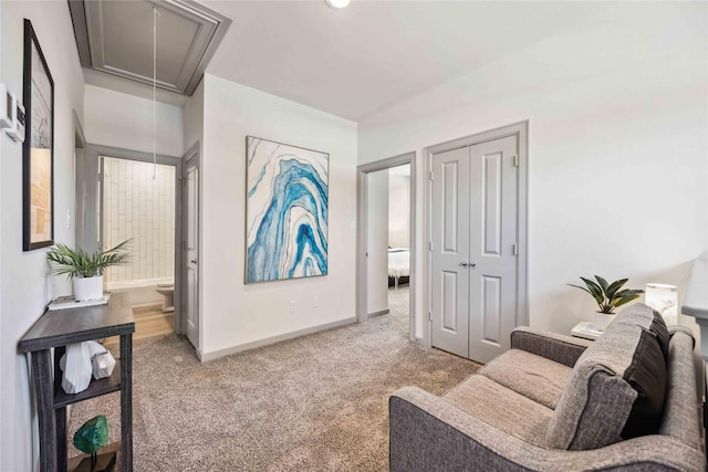 sitting room featuring light carpet