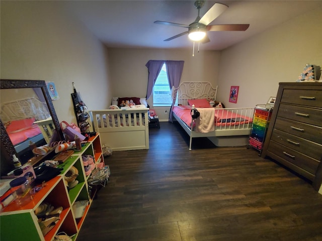 bedroom featuring dark hardwood / wood-style floors and ceiling fan