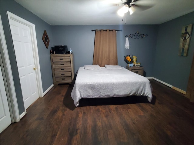 bedroom featuring ceiling fan and dark hardwood / wood-style flooring