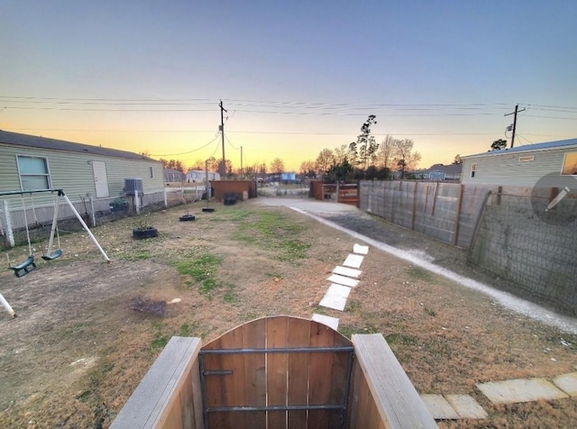 view of yard at dusk