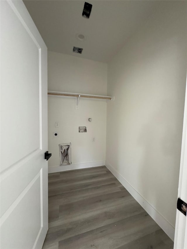 washroom with hookup for an electric dryer and hardwood / wood-style floors