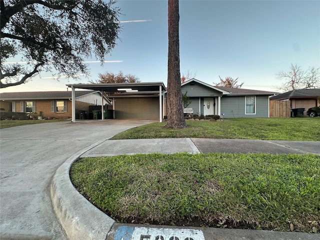 ranch-style house with a front yard and a carport