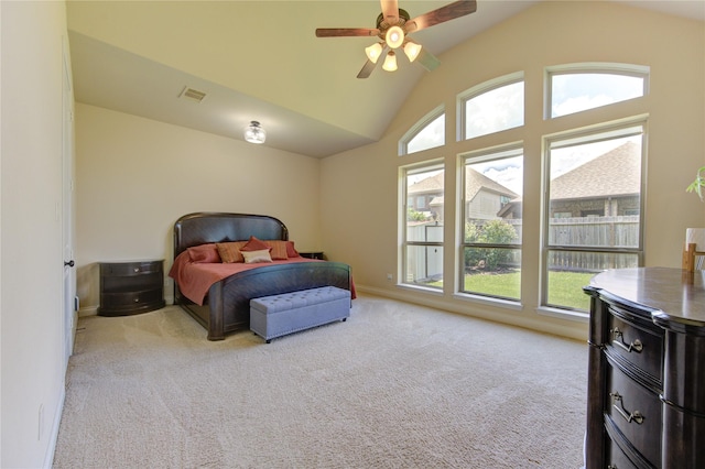 bedroom featuring high vaulted ceiling, light colored carpet, and ceiling fan