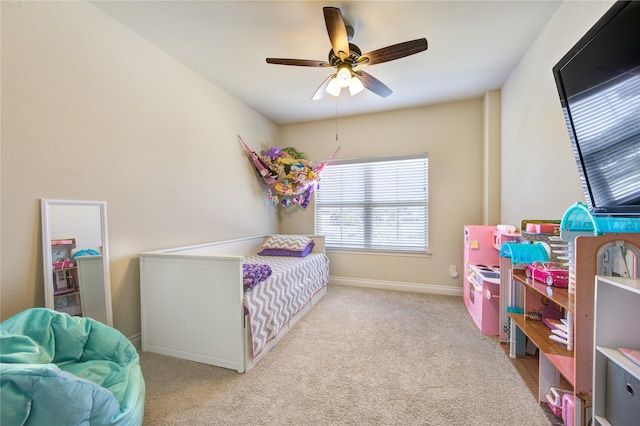 bedroom featuring light colored carpet and ceiling fan