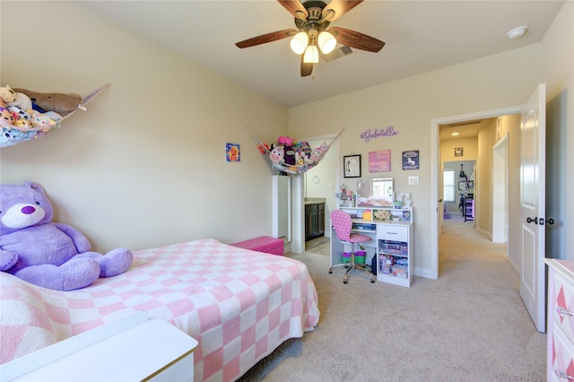 bedroom with light colored carpet and ceiling fan