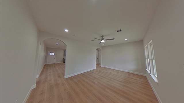 empty room featuring ceiling fan and light wood-type flooring