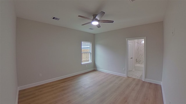 spare room featuring ceiling fan and light wood-type flooring