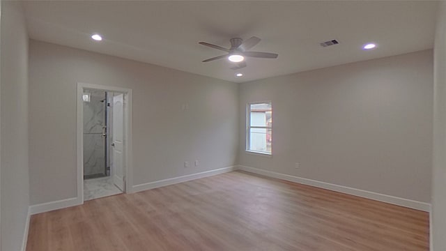 spare room featuring ceiling fan and light hardwood / wood-style floors