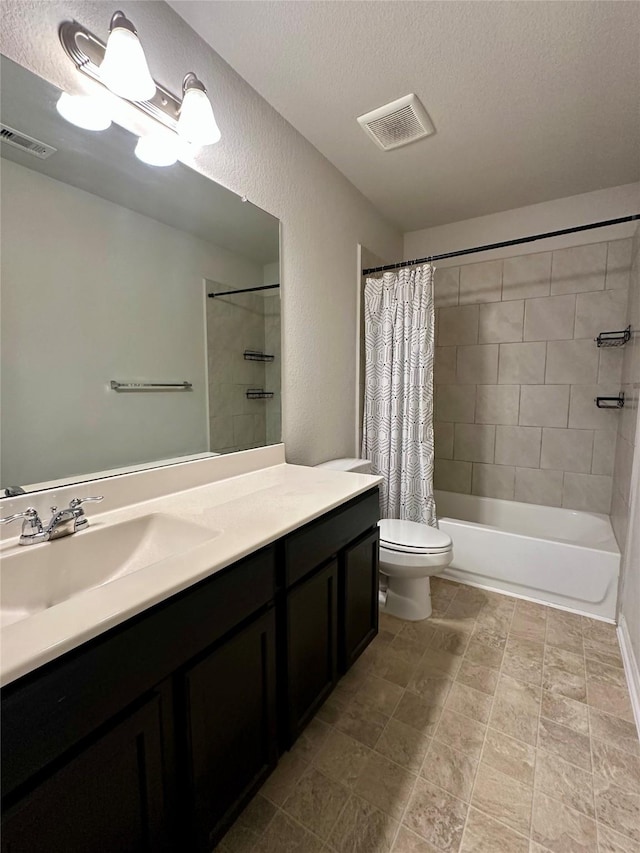 full bathroom with vanity, a textured ceiling, toilet, and shower / tub combo with curtain