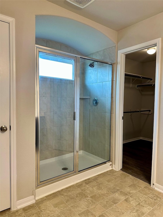 bathroom featuring an enclosed shower