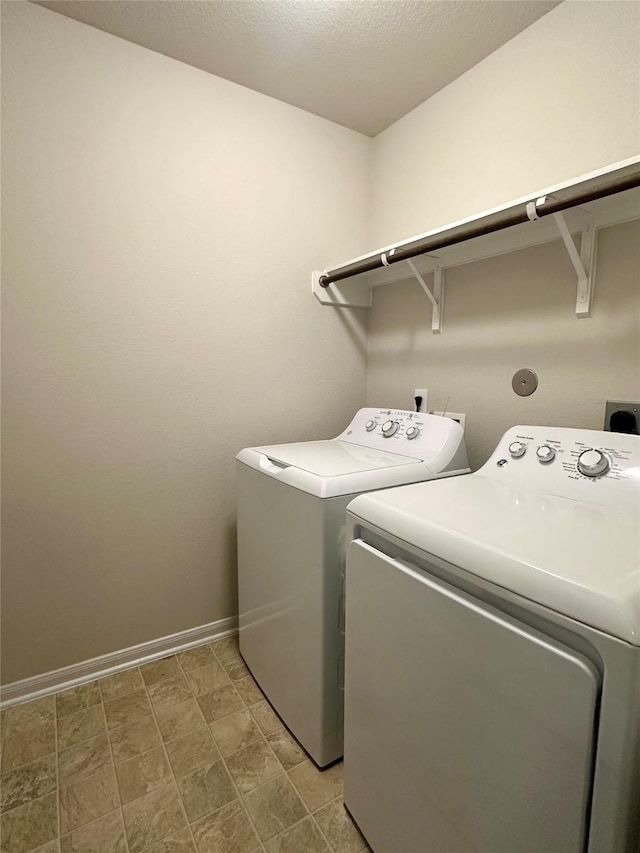 washroom featuring washing machine and clothes dryer