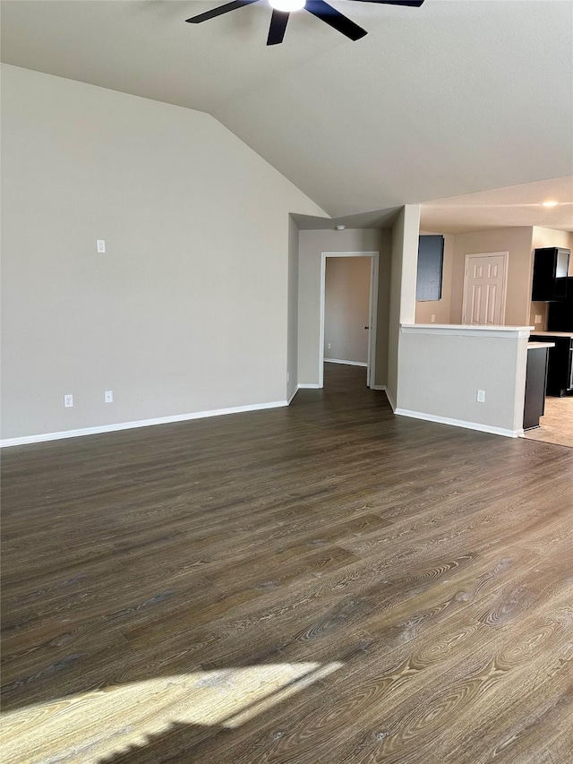 unfurnished living room featuring dark wood-type flooring, ceiling fan, and vaulted ceiling