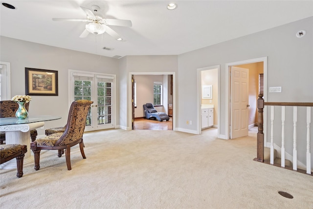 interior space with french doors and ceiling fan