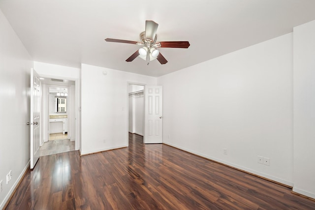 unfurnished bedroom featuring dark hardwood / wood-style flooring and ceiling fan