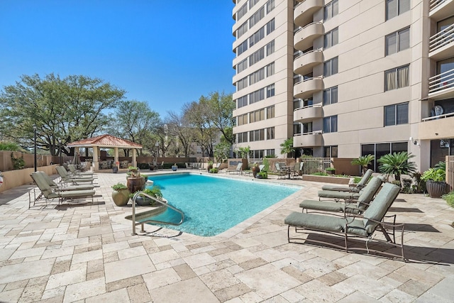 view of swimming pool with a gazebo and a patio