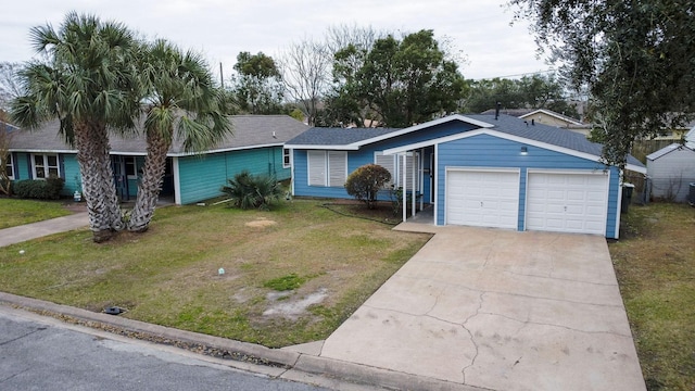 ranch-style house with a garage and a front yard