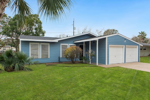 ranch-style house featuring a garage and a front yard