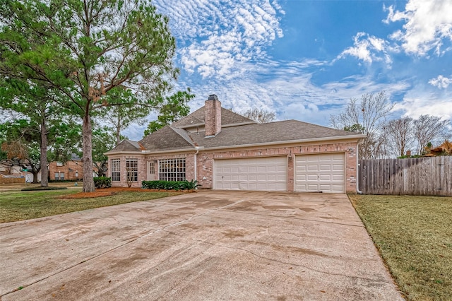 view of front facade with a garage and a front yard