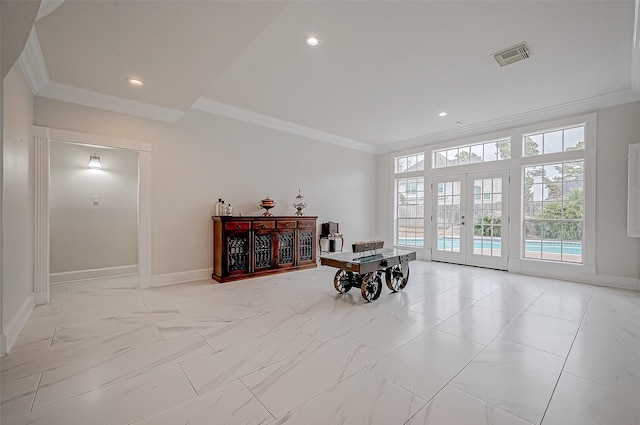 interior space with crown molding and french doors