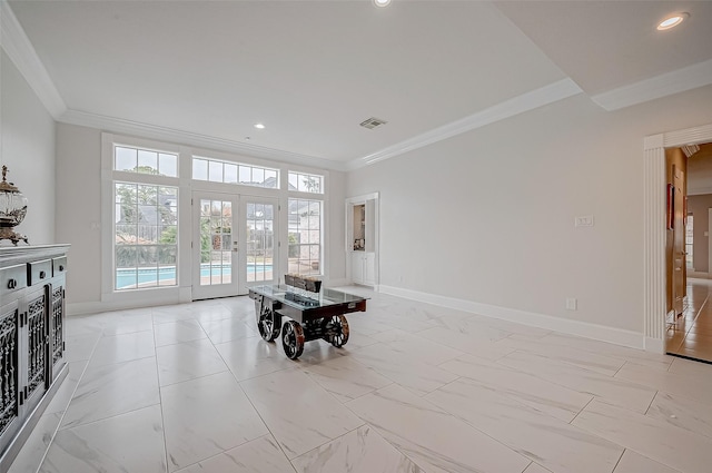 interior space with french doors and ornamental molding