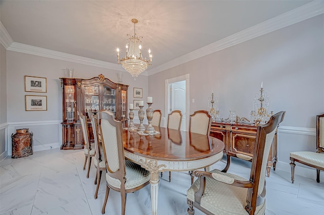 dining room with a notable chandelier and crown molding