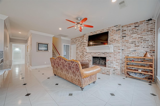 living room featuring ceiling fan, brick wall, a fireplace, ornamental molding, and light tile patterned flooring