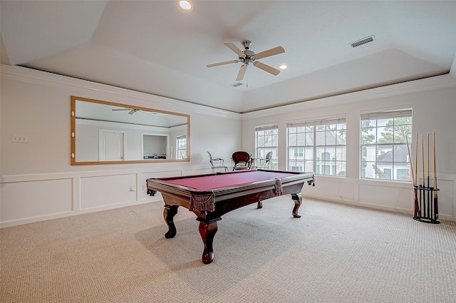 recreation room with a raised ceiling, crown molding, and carpet