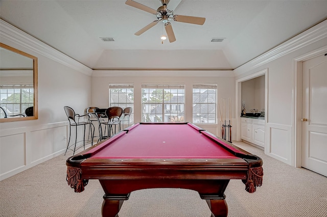 playroom with plenty of natural light, light carpet, and a tray ceiling