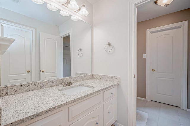 bathroom with tile patterned flooring and vanity