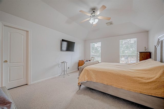 carpeted bedroom with lofted ceiling and ceiling fan