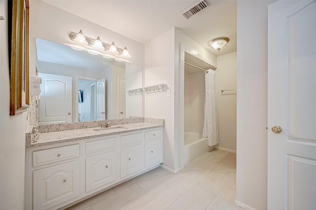 bathroom featuring vanity, shower / tub combo, and tile patterned floors