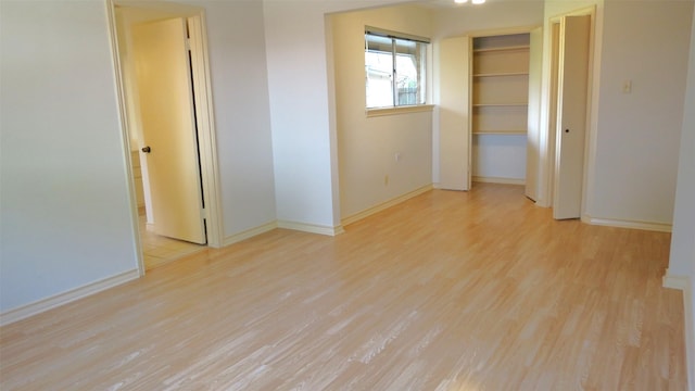 spare room with light hardwood / wood-style flooring