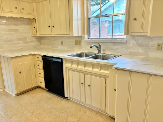 kitchen featuring black dishwasher, sink, backsplash, and cream cabinetry