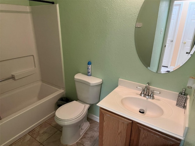 full bathroom featuring washtub / shower combination, tile patterned floors, toilet, and vanity