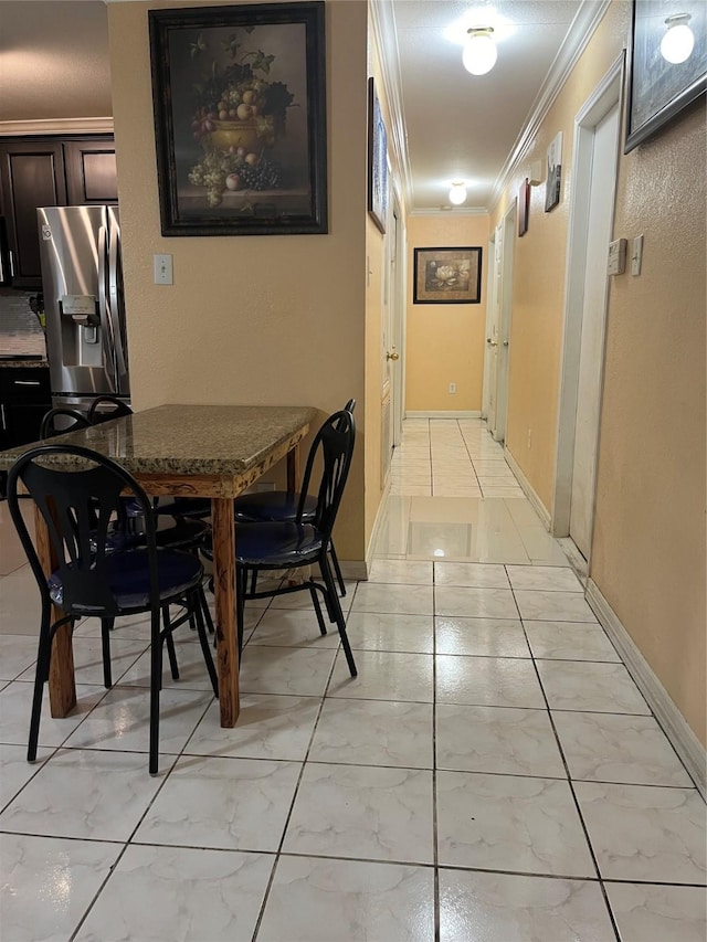 dining area featuring ornamental molding