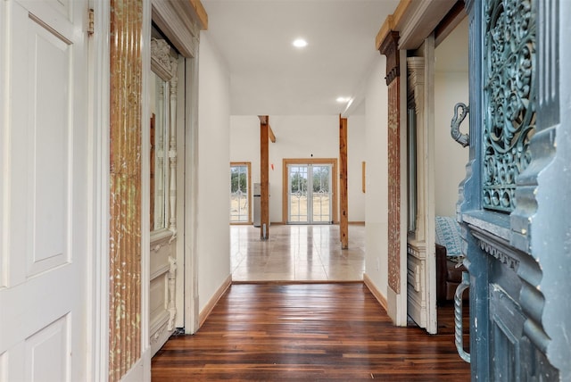 hall with dark hardwood / wood-style flooring