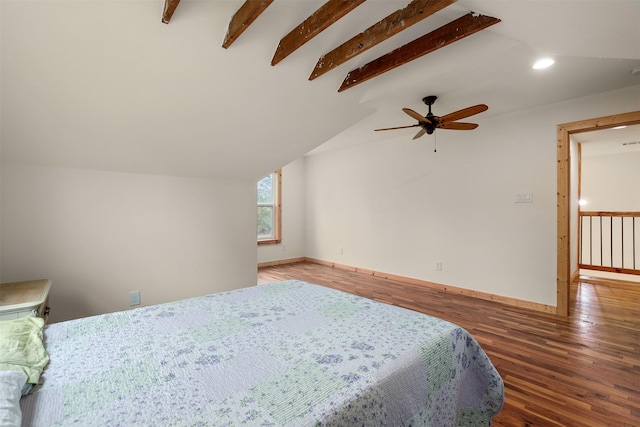 bedroom featuring dark hardwood / wood-style flooring, vaulted ceiling with beams, and ceiling fan