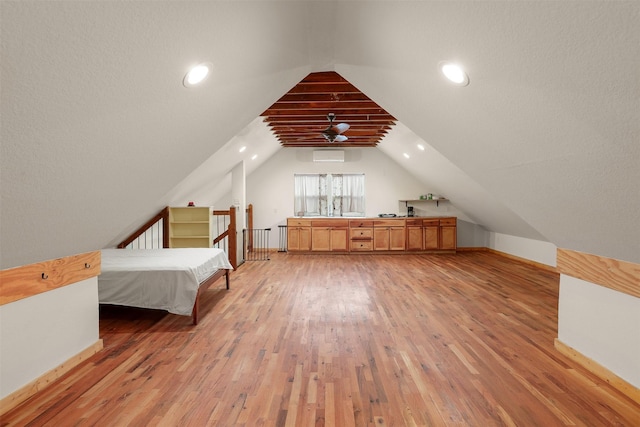 interior space featuring vaulted ceiling and light hardwood / wood-style flooring