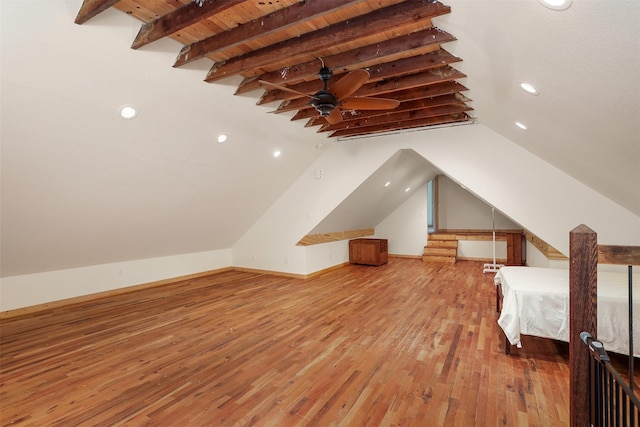 bonus room featuring wood ceiling, ceiling fan, wood-type flooring, and vaulted ceiling with beams