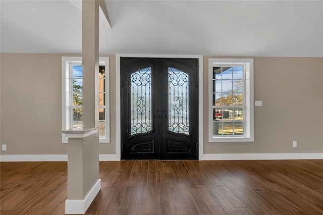 entryway with hardwood / wood-style flooring and french doors