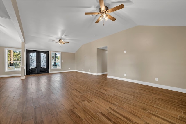 unfurnished living room with french doors, ceiling fan, lofted ceiling, and hardwood / wood-style flooring