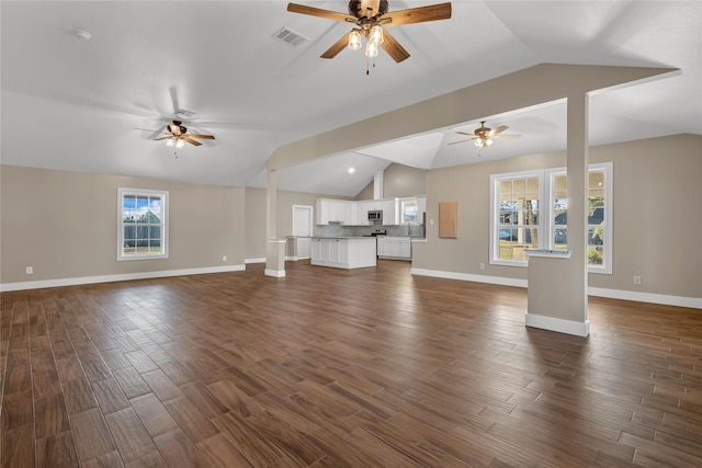 unfurnished living room with lofted ceiling, dark wood-type flooring, and ceiling fan